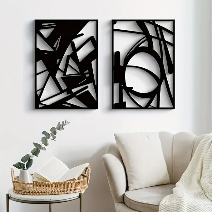 Abstract metal wall art with minimalist single line design displayed above a stylish couch.