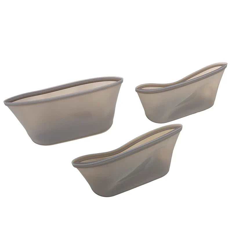 3-piece set of reusable silicone food storage bags in varying sizes.