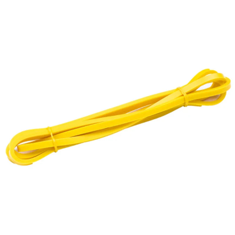 Yellow rubber resistance band for fitness and bodybuilding workouts.