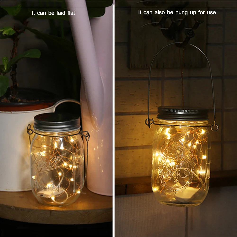 Solar mason jar lights on table and hanging, glowing warmly.