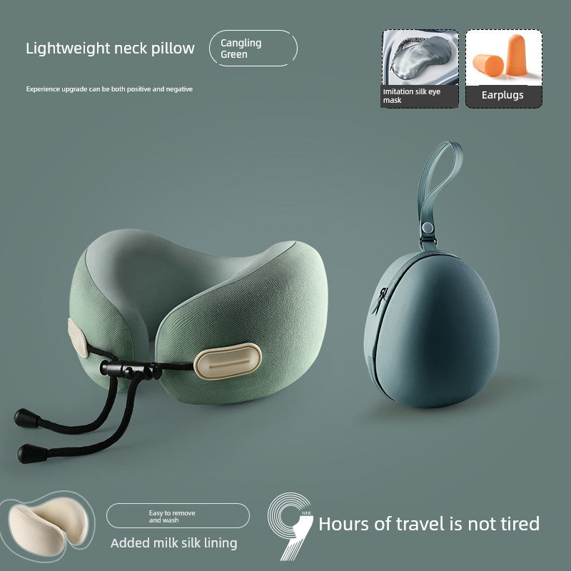 U-shaped travel pillow in sage green with memory foam, designed for neck support, includes a storage pouch and earplugs.