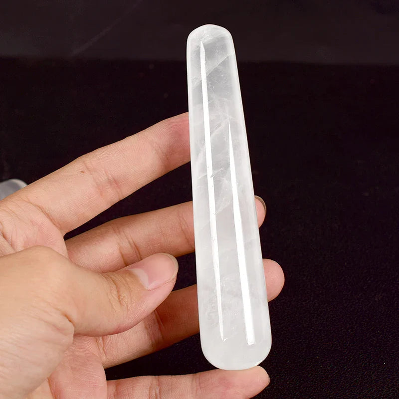 Crystal face massager made of natural rose quartz for facial relaxation and skin care.