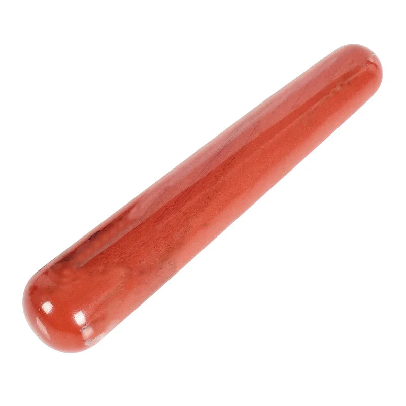 Natural rose quartz crystal face massager for skin care and relaxation.