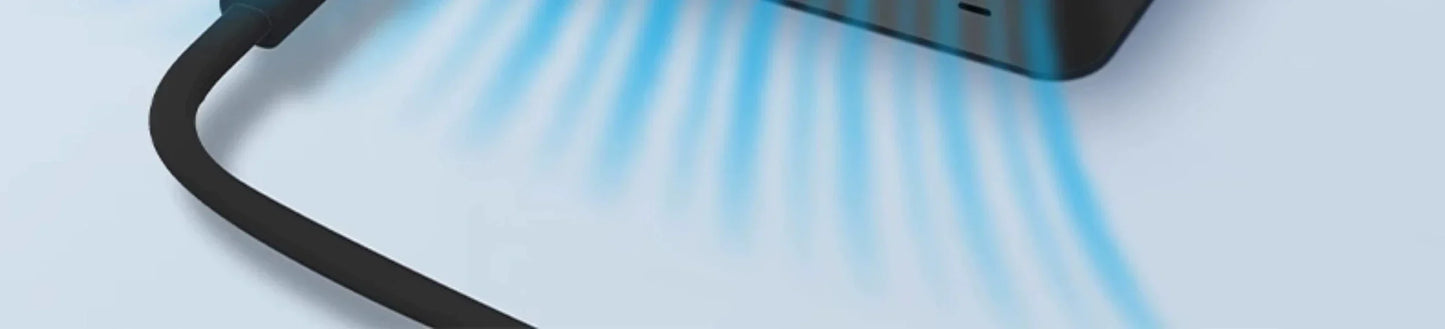 GaN fast charger with blue light indicating wireless charging.
