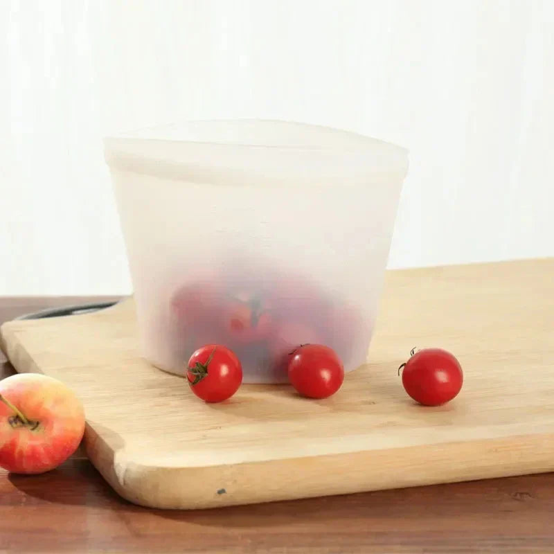 reusable silicone food storage bag with tomatoes on wooden board
