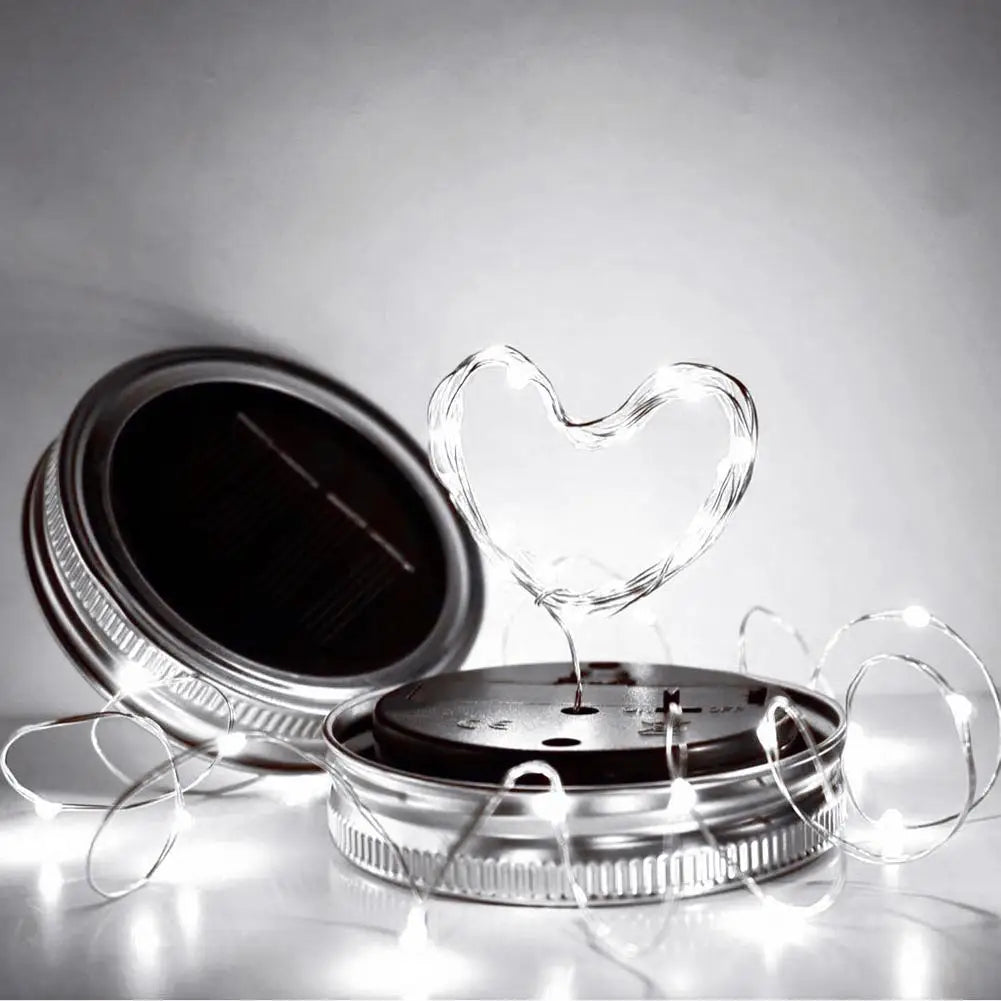 Solar mason jar lights with LED heart shape, eco-friendly and solar-powered.