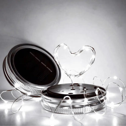 Solar mason jar lights with LED heart shape, eco-friendly and solar-powered.