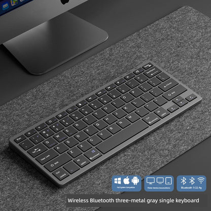 Wireless rechargeable keyboard with Bluetooth connectivity on a desk.