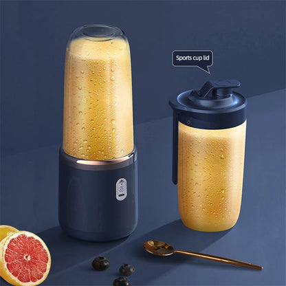 Portable fruit juice blender with sports cup lid, sleek design, and two cups filled with fresh juice on a kitchen counter.