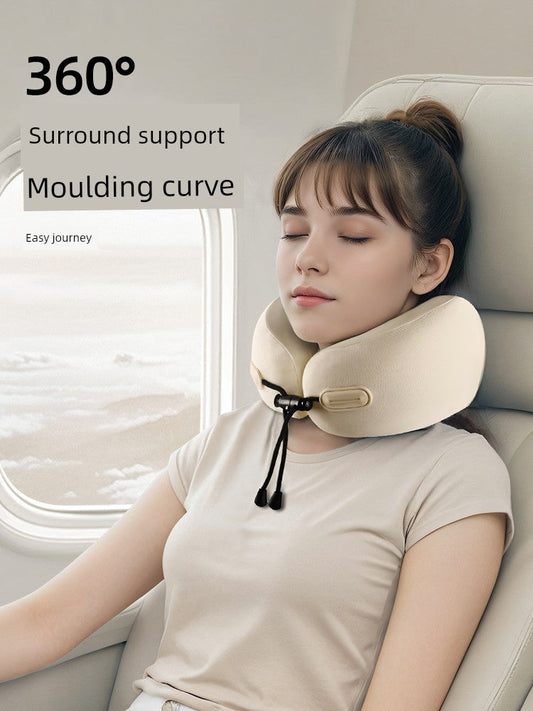 U-shaped travel pillow providing 360° neck support on an airplane.