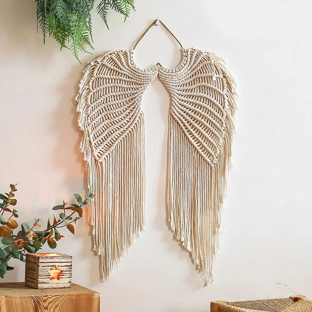 Handmade macrame wall hanging tapestry with angel wing design, rustic decor for home, living room, or bedroom.