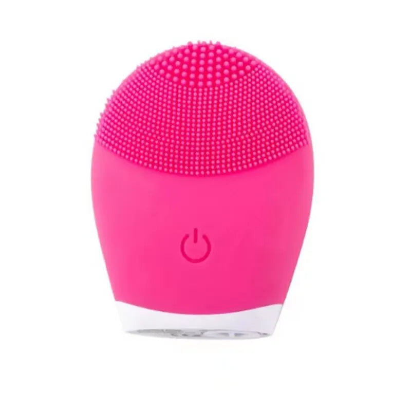 Pink electric facial cleansing brush with silicone bristles for deep cleaning and vibration massage.
