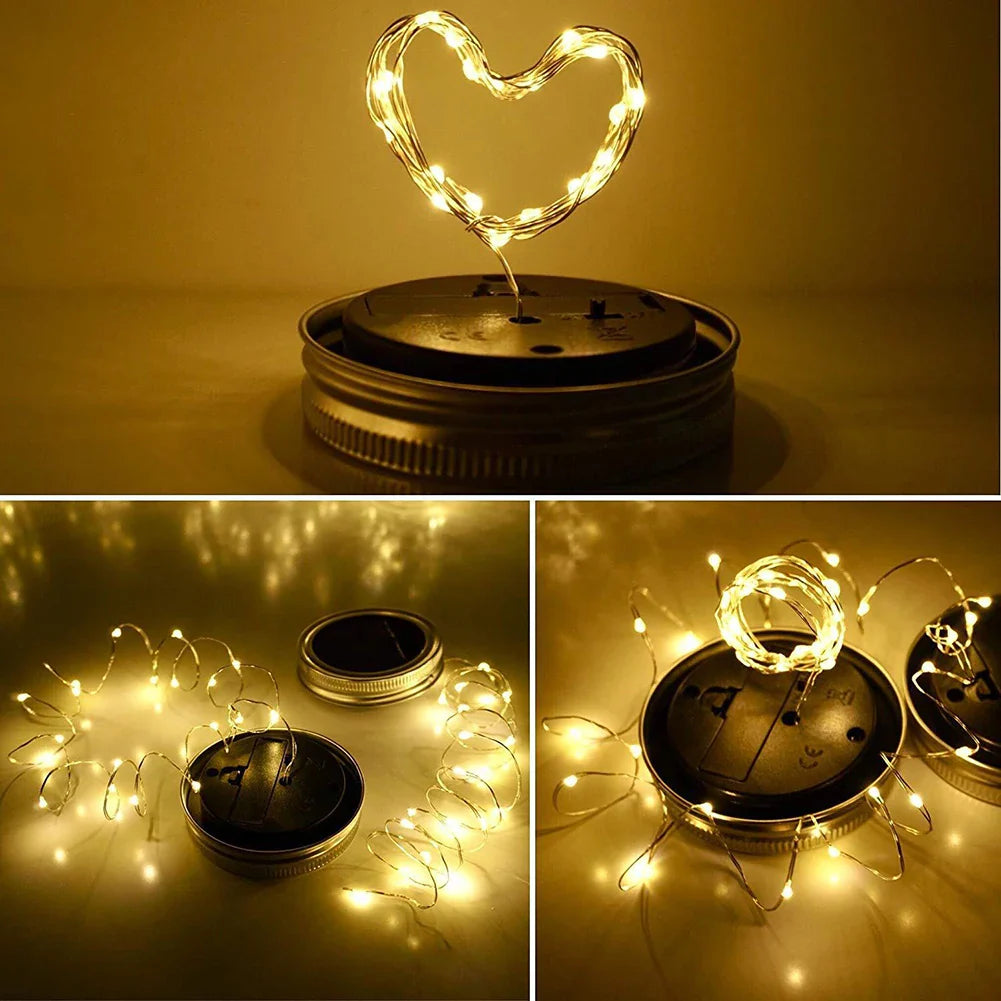 Solar mason jar lights with warm white LEDs arranged in creative shapes.