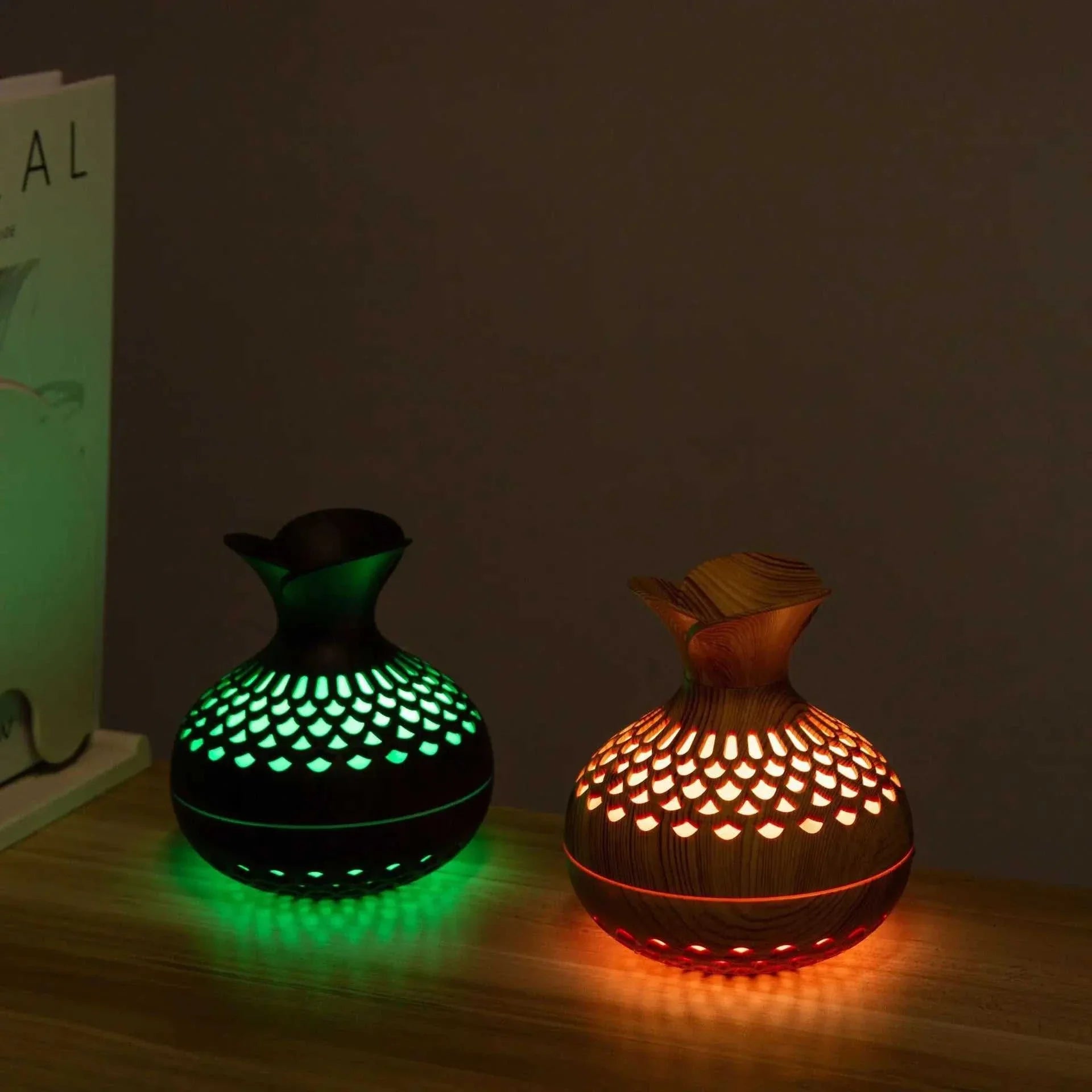 Wood grain humidifiers with colorful gradient lights on a wooden surface.