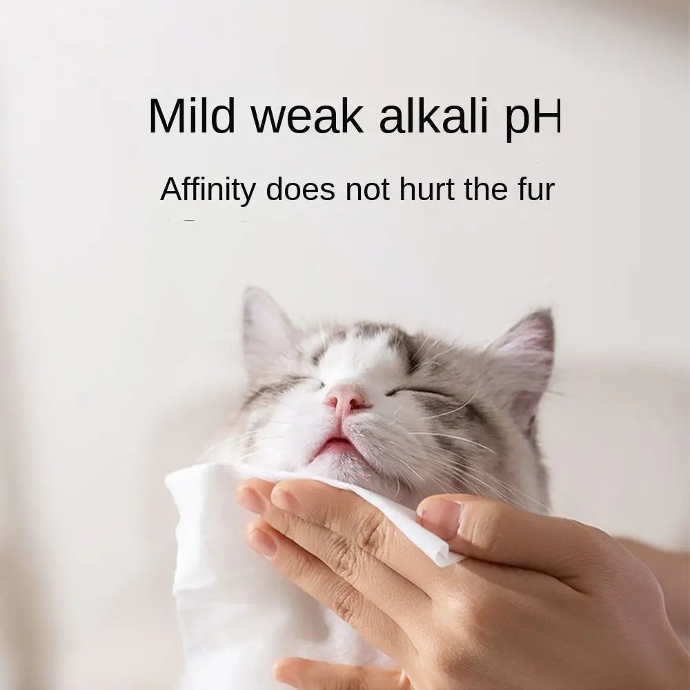 Pet wipes gently cleaning a cat's face with mild pH formula.