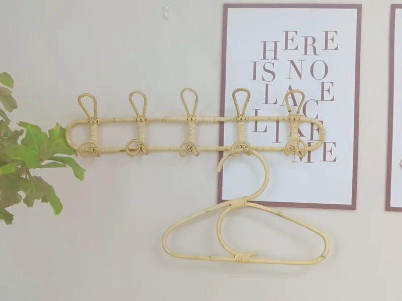 Rattan wall hooks for children's room organization and decoration.
