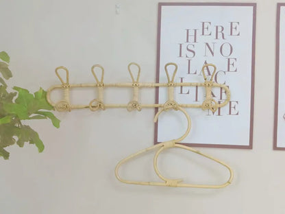 Rattan wall hooks for children's room organization and decoration.