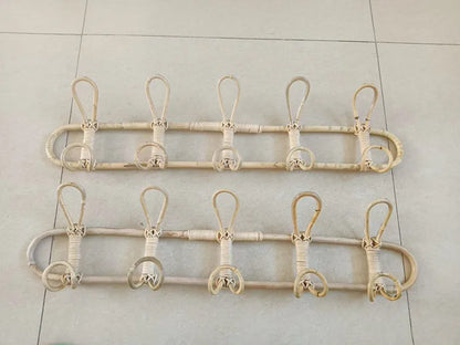 Rattan wall hooks for children's room organization.