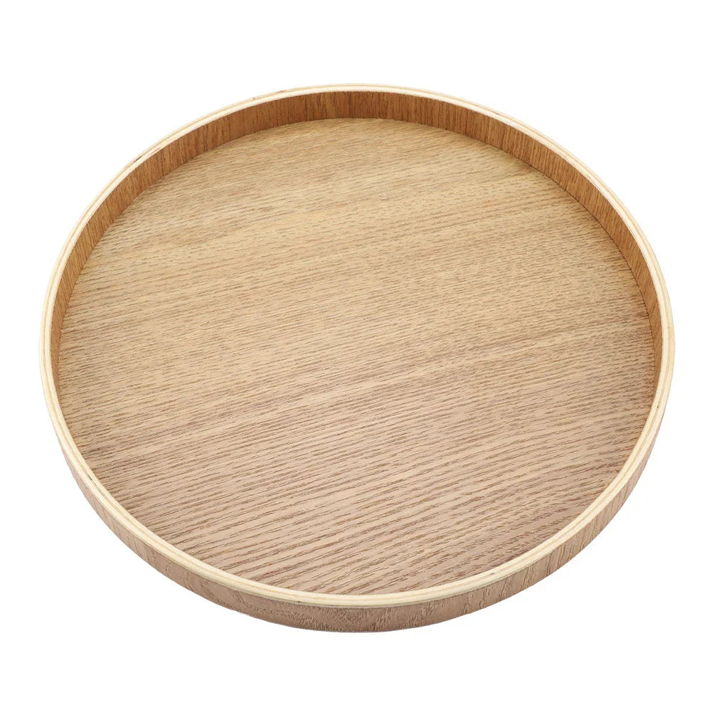 Wooden serving tray for tea, fruits, and desserts, round design, kitchen accessory.