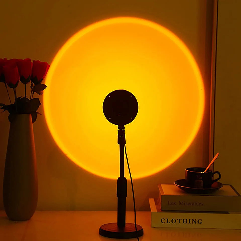 Sunset lamp projection creating a warm glow, showcasing LED atmosphere lighting with a 360° rotation feature.