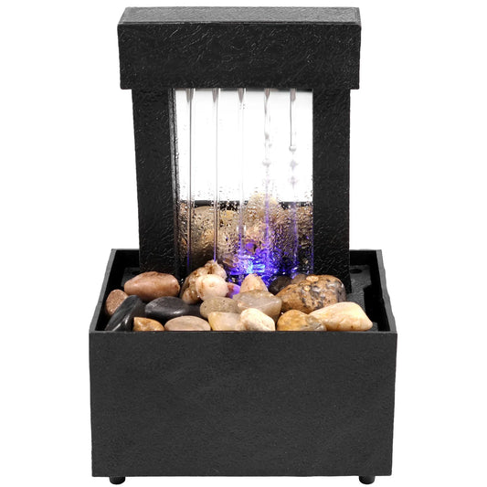 Tabletop fountain with light featuring pebbles and modern design for indoor relaxation.