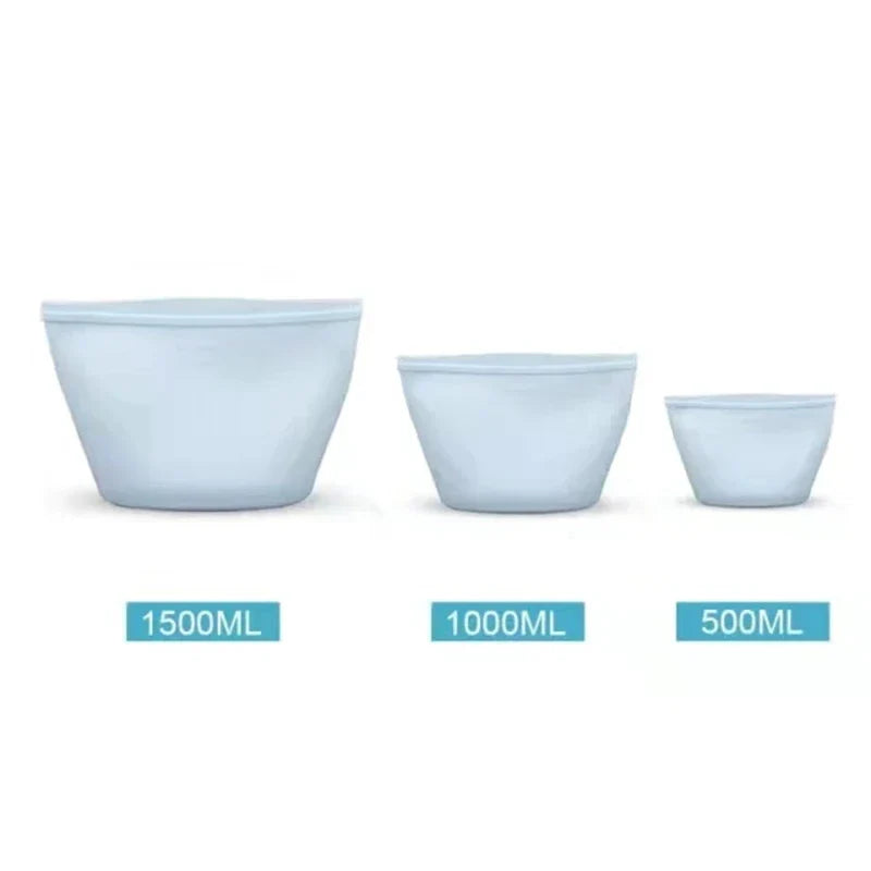 Set of three reusable silicone food storage bags in various sizes: 1500ml, 1000ml, and 500ml.