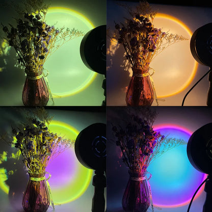 Sunset lamp projecting colorful LED lights on a wall illuminating flowers in a vase.