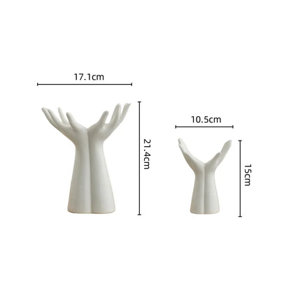 Modern ceramic vase shaped like hands, ideal for bouquets and home decoration.