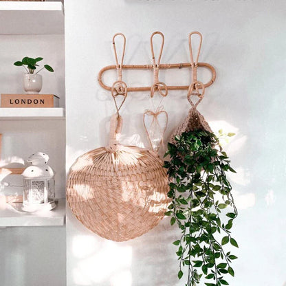 Rattan wall hooks for kids' room decoration with natural rattan design.