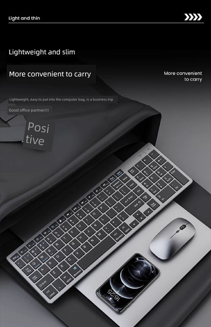 Slim wireless rechargeable keyboard next to portable mouse and smartphone on sleek surface.