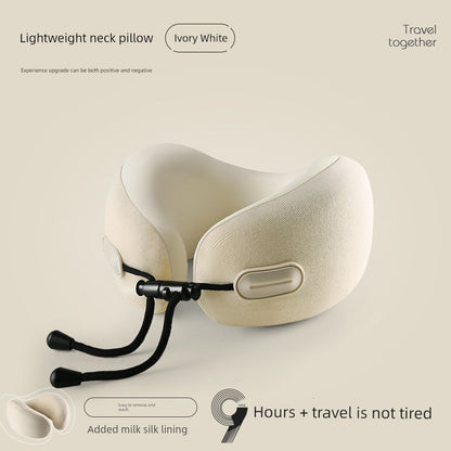 Ivory white U-shaped travel pillow with memory cotton fill and neck guard feature.