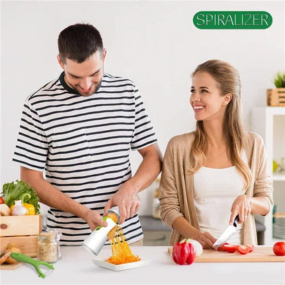 A couple using a vegetable spiralizer in a kitchen setting.