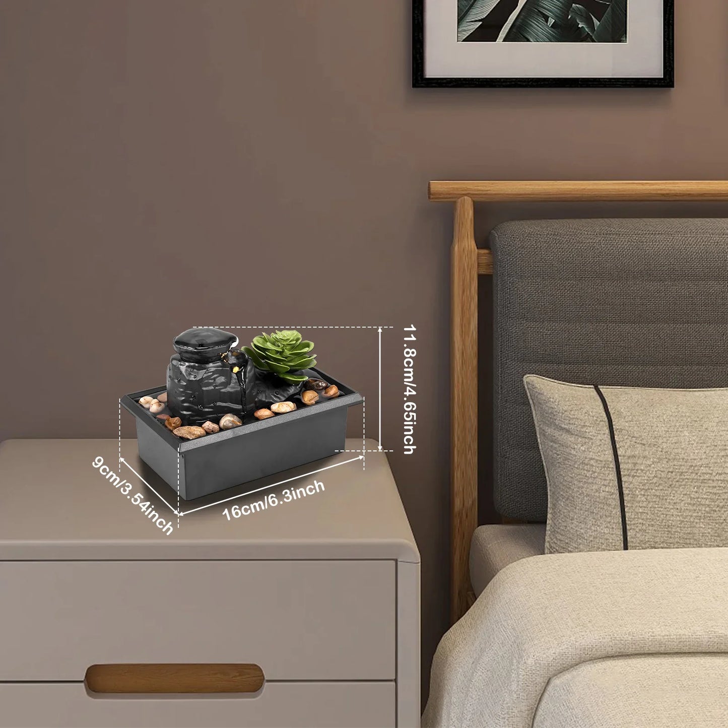 Mini indoor tabletop fountain with light, modern Zen meditation decor on a bedside table.