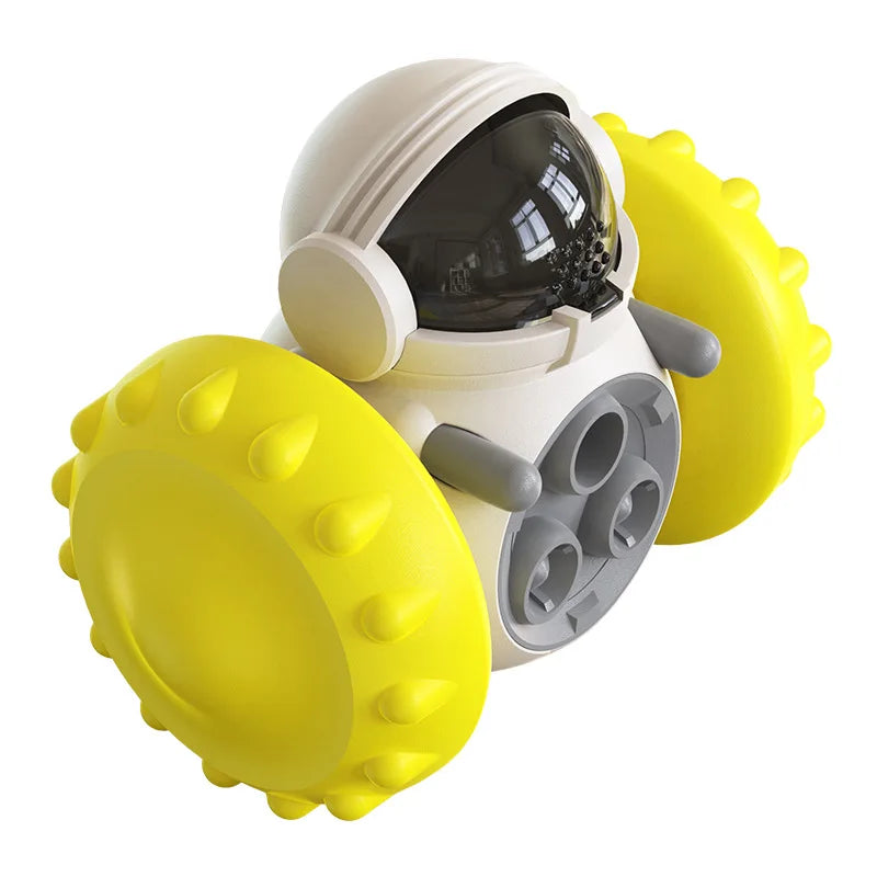 Interactive treat dispensing dog toy with yellow spiked wheels and white body, made of ABS material.