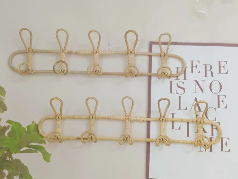 Rattan wall hooks for kids' room organization, featuring natural rattan material for clothes and hat hanging.