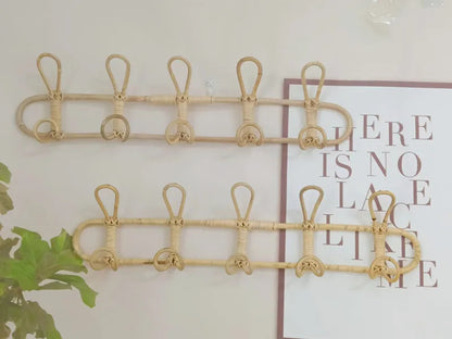 Rattan wall hooks for kids' room organization, featuring natural rattan material for clothes and hat hanging.
