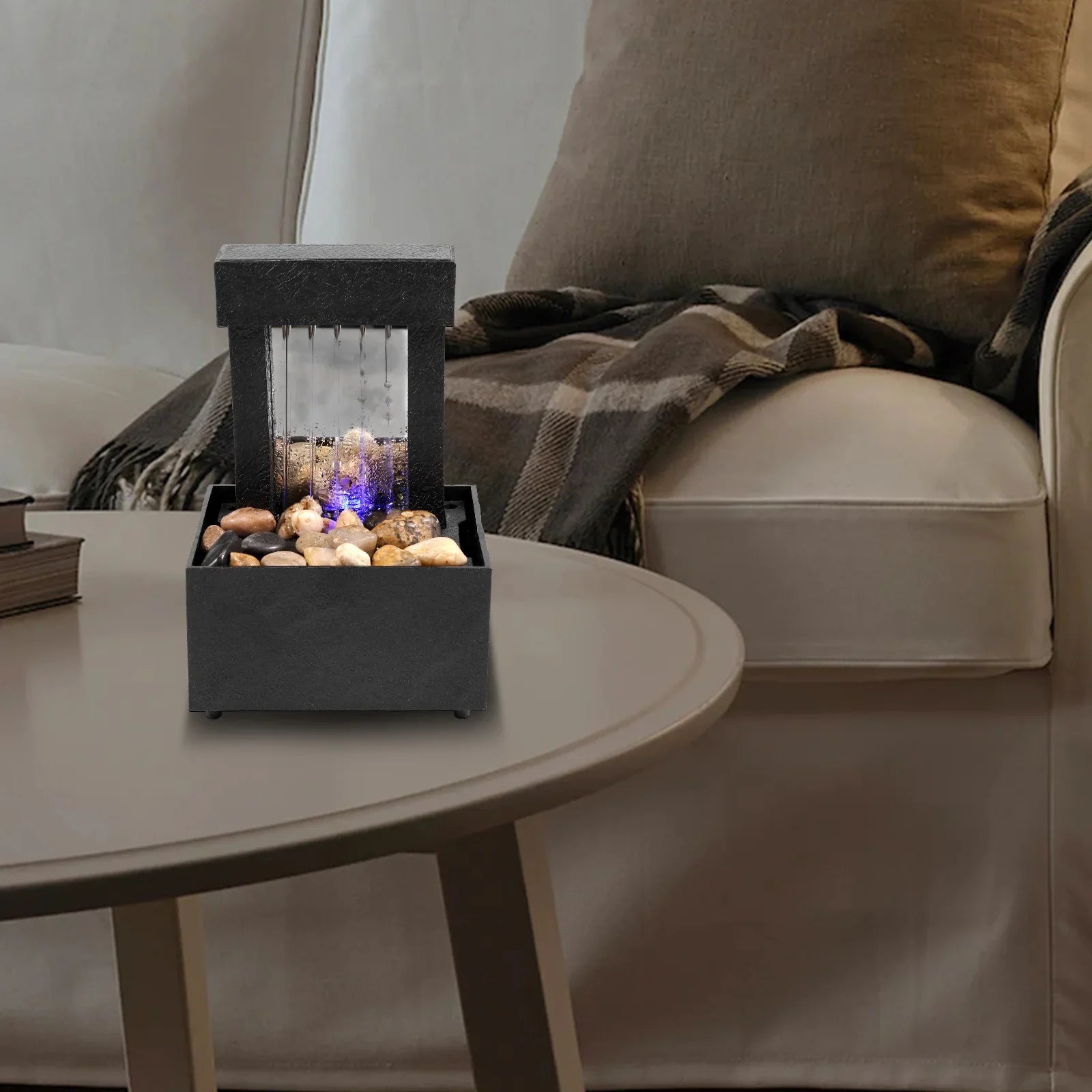 Mini indoor tabletop fountain with light, modern Zen decor, sound relaxation feature.
