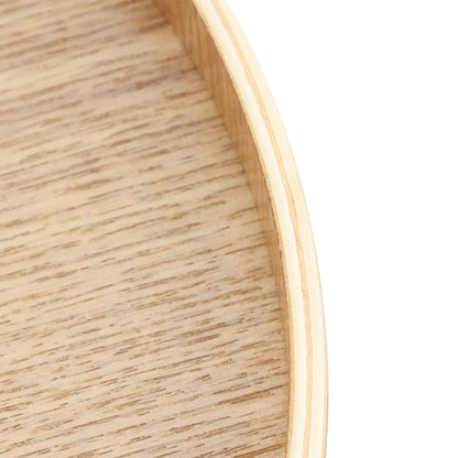 Wooden serving tray close-up showing natural grain and round edge design.