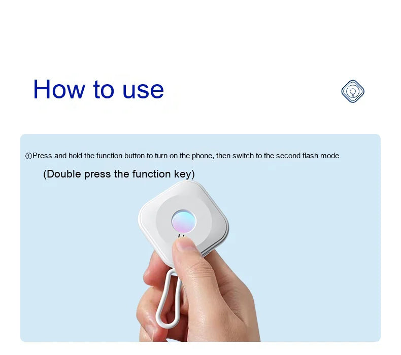 Hand holding smart mini camera detector with a finger pressing the function button against a light blue background with usage instructions.